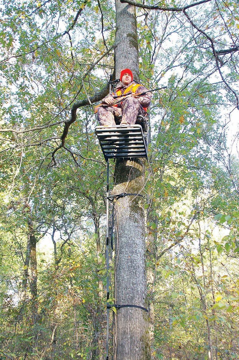 Pre-hunt scouting can help the whitetail enthusiast select the best stand location, the way Matt Sutton of Alexander chose this stand. Without scouting, everything is left to chance, and one might never get a shot.