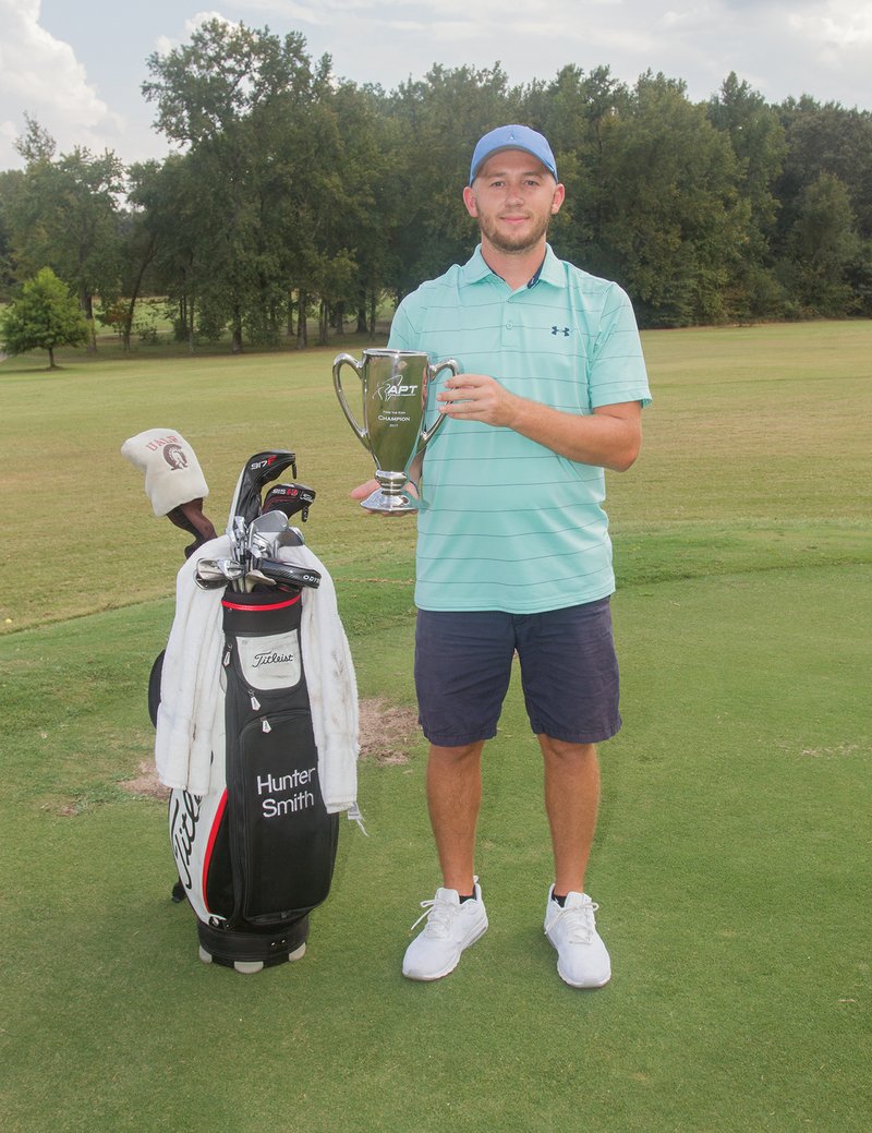 Hunter Smith of Cabot holds his trophy for winning the Adams Tour Fore the Kids Tournament in Brownwood, Texas. Smith, 24, won his first professional championship by one stroke over former Louisiana State University golfer Sam Burns. The tournament took place Sept. 13-16 at the Brownwood Country Club.