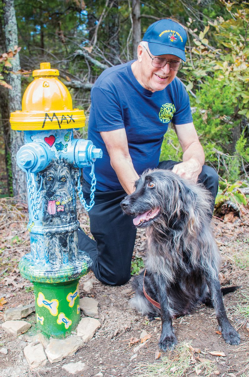 Steve Sutay adopted a fire hydrant from the Fairfield Bay Hydrants for a Cause project and had the hydrant painted in honor of his Irish wolfhound, Max. Steve and his wife, Shirley, moved to Fairfield Bay 23 years ago from New York, where he was a firefighter; he also served as a firefighter in Fairfield Bay. Max is a rescue dog and likes to go fishing with Sutay.