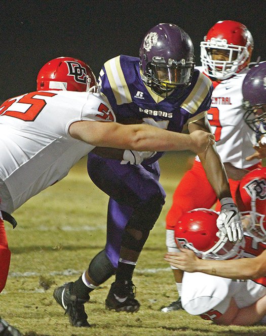 Terrance Armstard/News-Times Junction City running back Hishmma Taylor tries to break through the Drew Central defense during their 6-3A contest on Thursday night at David Carpenter Stadium. The Dragons beat the Pirates 60-6.