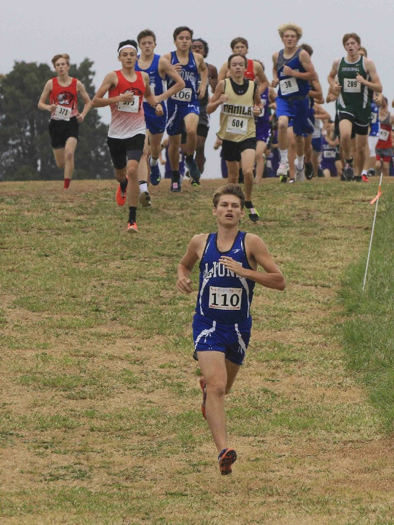 Noah Eskew of Jessieville leads the pack while winning the Class 3A boys state cross country race at Oaklawn Park. Eskew’s winning time was 16 minutes, 31.6 seconds.