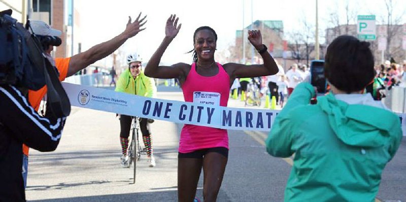 Sika Henry (center), is shown a moment before winning her second consecutive Newport News One City Marathon in Newport News, Va., in March 2016. 
