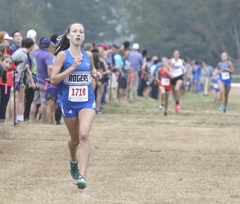 Rogers High’s Ali Nachtigal approaches the finish line Friday to claim the top spot in the Class 7A girls state cross country championship in Hot Springs.