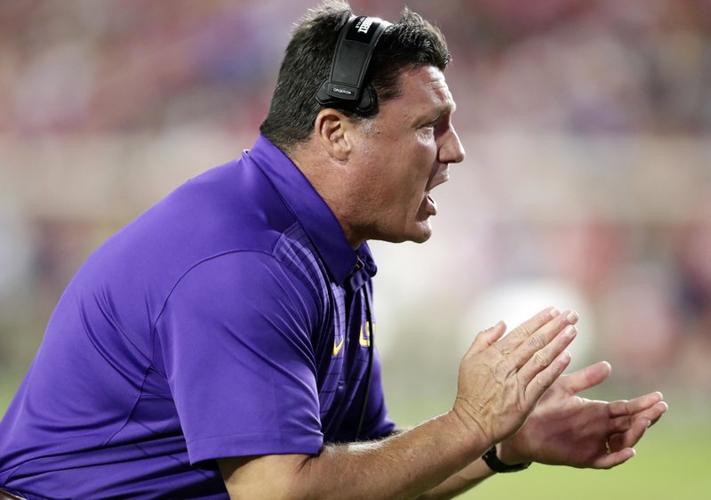 LSU head coach Ed Orgeron encourages his players in the first half of an NCAA college football game against Mississippi in Oxford, Miss., Saturday, Oct. 21, 2017. No. 24 LSU won 40-24. 