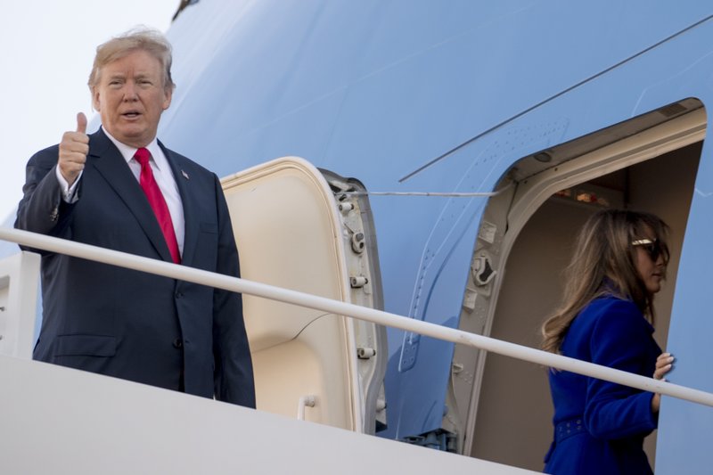 President Donald Trump gives a thumbs up as he and first lady Melania Trump board Air Force One at Andrews Air Force Base, Md., Friday, Nov. 3, 2017, to travel to Joint Base Pearl Harbor Hickam, in Hawaii. Trump begins a 5 country trip through Asia traveling to Japan, South Korea, China, Vietnam and the Philippians. (AP Photo/Andrew Harnik)