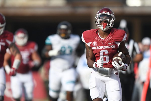 Arkansas running back T.J. Hammonds scores a touchdown during a game against Coastal Carolina on Saturday, Nov. 4, 2017, in Fayetteville. 