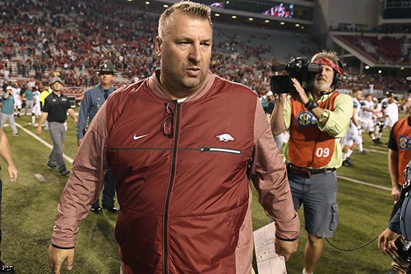 Arkansas coach Bret Bielema heads to the locker room after defeating Coastal Carolina in an NCAA college football game Saturday, Nov. 4, 2017, in Fayetteville, Ark. (AP Photo/Michael Woods)

