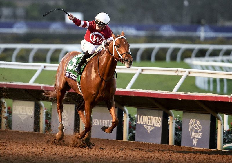 Florent Geroux rides Gun Runner to victory in the Classic race during the Breeders’ Cup on Saturday in Del Mar, Calif. 