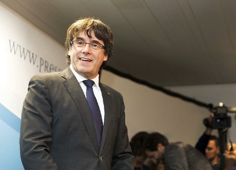 Sacked Catalonian President Carles Puigdemont smiles during a press conference in Brussels, Tuesday, Oct. 31, 2017. 