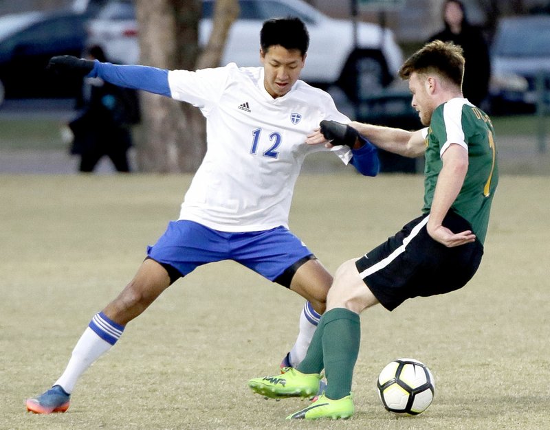 Photo courtesy of JBU Sports Information John Brown University's Steve Teshima goes up against a Science and Arts (Okla.) player during Tuesday's match in Chickasha, Okla.