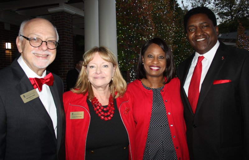 University of Arkansas Chancellor Joe Steinmetz and wife Sandy (from left) and Monica and Victor Wilson, Chancellor's Society honorary co-hosts, welcome members of the giving group to the annual reception Oct. 20 at the Fowler House Garden and Conservatory in Fayetteville.