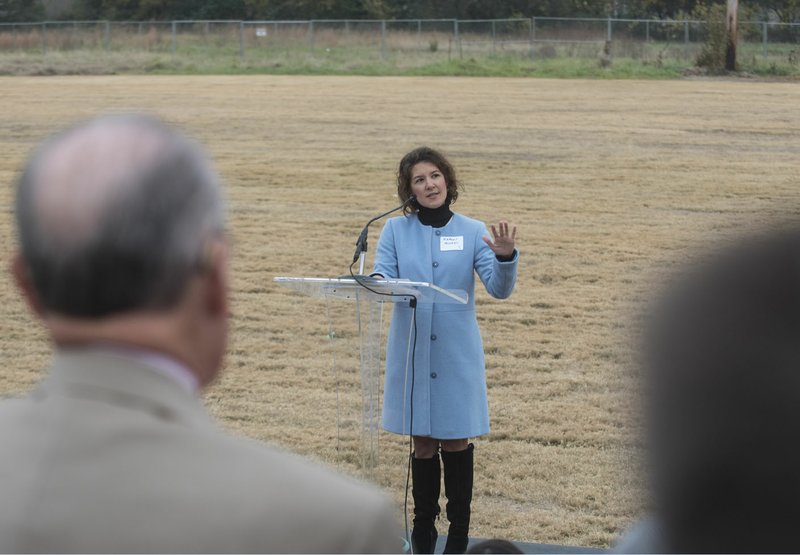 NWA Democrat Gazette/SPENCER TIREY Karen Minkel, director of the Walton Family Foundation Home Region Program talk to a crowd Friday during a groundbreaking event at the Thaden School, an independent school in Bentonville. Construction of the school's campus is underway and the first buildings are scheduled for completion in 2018 with the rest to follow by 2020. The school opened this fall in temporary classrooms and offices that will be decommissioned as permanent buildings become available.