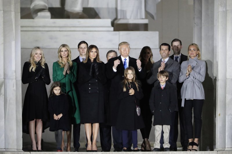 In this Jan. 19, 2017, file photo, then-President-elect Donald Trump and his wife Melania Trump and family wave at the conclusion of the pre-Inaugural "Make America Great Again! Welcome Celebration" at the Lincoln Memorial in Washington. 