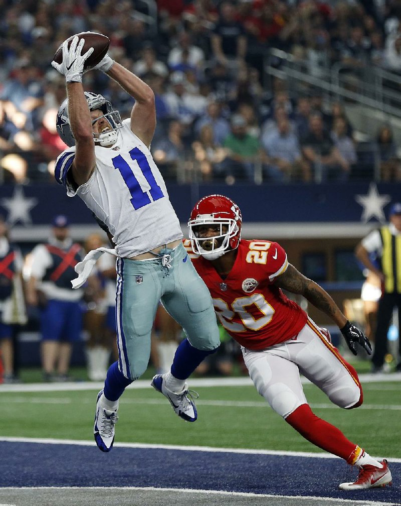 Dallas Cowboys wide receiver Cole Beasley (left) catches a 6-yard touchdown pass in front of Kansas City Chiefs defensive back Steven Nelson during the Cowboys’ 28-17 victory Sunday in Arlington, Texas. Beasley later had a 7-yard TD catch from Dak Prescott.