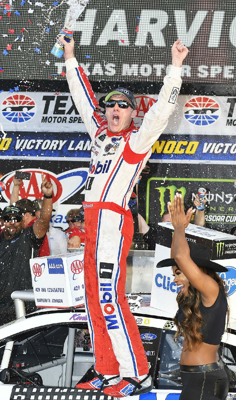 Kevin Harvick celebrates after winning Sunday’s AAA Texas 500 at Texas Motor Speedway. The victory secured Harvick a spot in the championship round of the Monster Energy Cup playoffs.