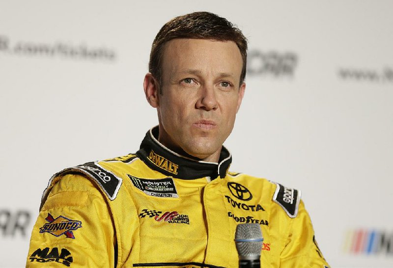 In this Jan. 24, 2017, file photo, Matt Kenseth answers a question during a news conference at the NASCAR Media Tour in Charlotte, N.C. 