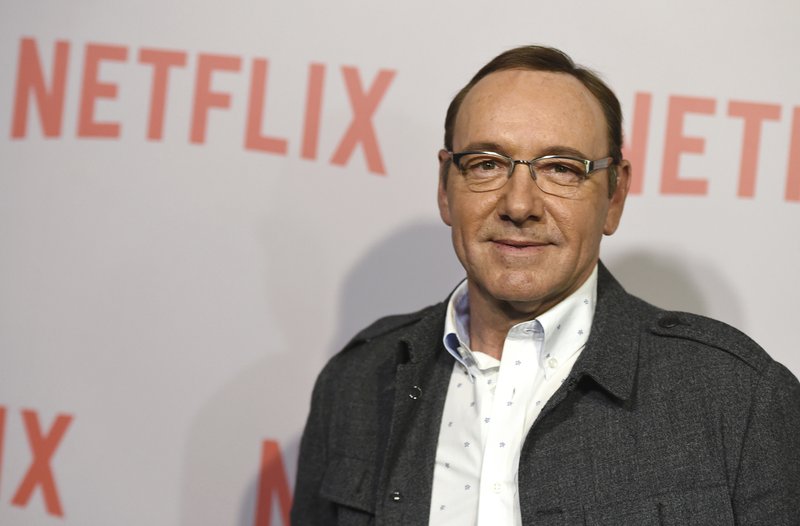FILE - In this April 27, 2015 file photo, Kevin Spacey arrives at the Q&amp;A Screening of &quot;The House Of Cards&quot; at the Samuel Goldwyn Theater in Beverly Hills, Calif. Netflix says Spacey is out at &quot;House of Cards&quot; after a series of allegations of sexual harassment and assault. Netflix says in a statement Friday night, Nov. 3, 2017, that it's cutting all ties with Spacey, and will not be involved with any further production of &quot;House of Cards&quot; that includes him. (Photo by Jordan Strauss/Invision/AP, File)