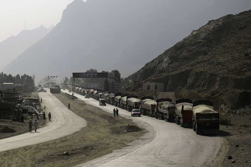 Trucks line up to enter Pakistan at the Torkhum border crossing in Torkhum, Nangarhar Province, Afghanistan, on Oct. 19, 2016. 