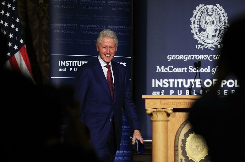 Former President Bill Clinton smiles as he arrives at a symposium in Georgetown University in Washington, Monday, Nov. 6, 2017. (AP Photo/Manuel Balce Ceneta)