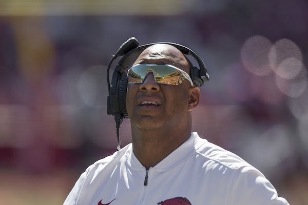Michael Smith, Arkansas wide receivers coach, watches a replay in the second quarter against New Mexico State Saturday, Sept. 30, 2017, at Razorback Stadium in Fayetteville. 

