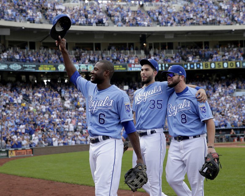 In this Sunday, Oct. 1, 2017 file photo, veteran Kansas City Royals players Lorenzo Cain (6), Eric Hosmer (35) and Mike Moustakas (8) aknowledge the crowd as they come out of the game during the fifth inning of a baseball game against the Arizona Diamondbacks in Kansas City, Mo.