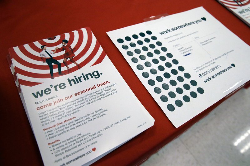 Information on available jobs lies on display Oct. 15 at a Target store in Chicago. On Tuesday, the Labor Department reports on job openings and labor turnover for September. (AP Photo/Nam Y. Huh)