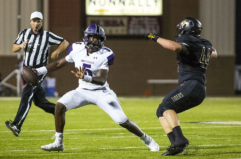 Playoff bound Fayetteville junior quarterback Darius Bowers (left) will lead the Bulldogs on Friday against Fort Smith Southside in the first round of the Class 7A playoffs. The Bulldogs are the No. 3 seed from the 7A-West Conference while the Mavericks are the No. 6 seed from the 7A-Central Conference. 

