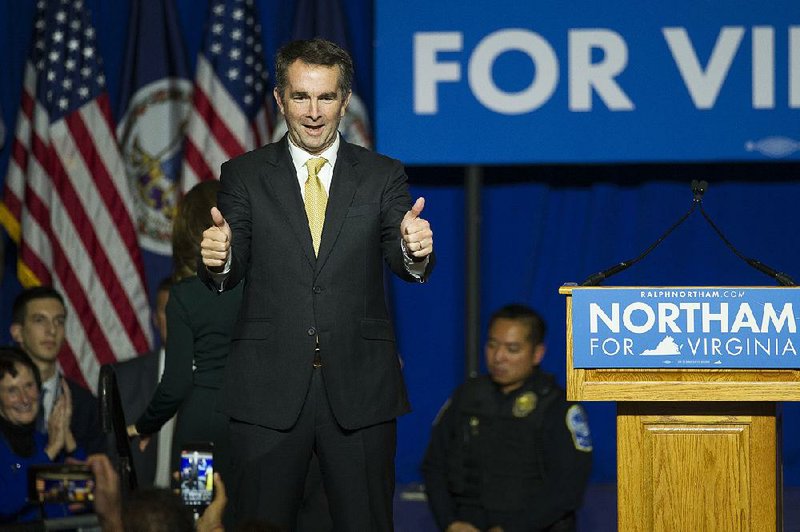 Virginia Gov.-elect Ralph Northam takes the stage Tuesday night in Fairfax at his election party. 
