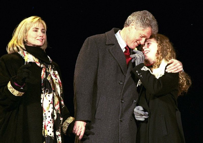 New President Bill Clinton celebrates with his wife, Hillary, and daughter, Chelsea, during festivities for his inauguration in Arlington, Va., in January 1993.