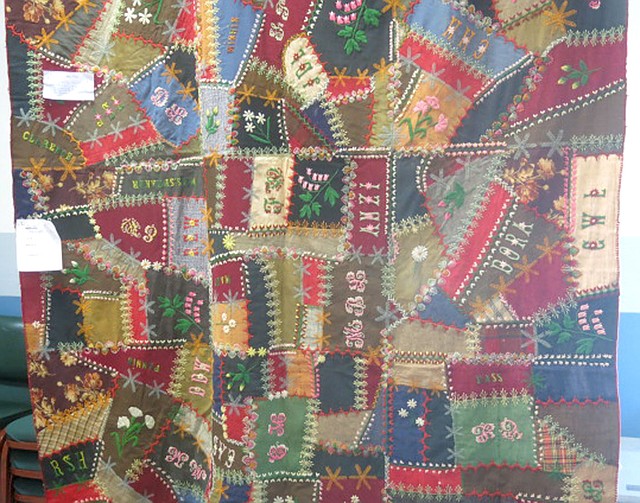 Photo by Susan Holland An antique crazy quilt, dating from the mid-1800s, received many votes for the people's favorite award in the "My Grandma and Me" quilt show Saturday, Oct. 28, at the Gravette Civic Center. The quilt, owned by the Gravette Historical Museum, features many colorful irregular blocks and several styles of decorative stitching.