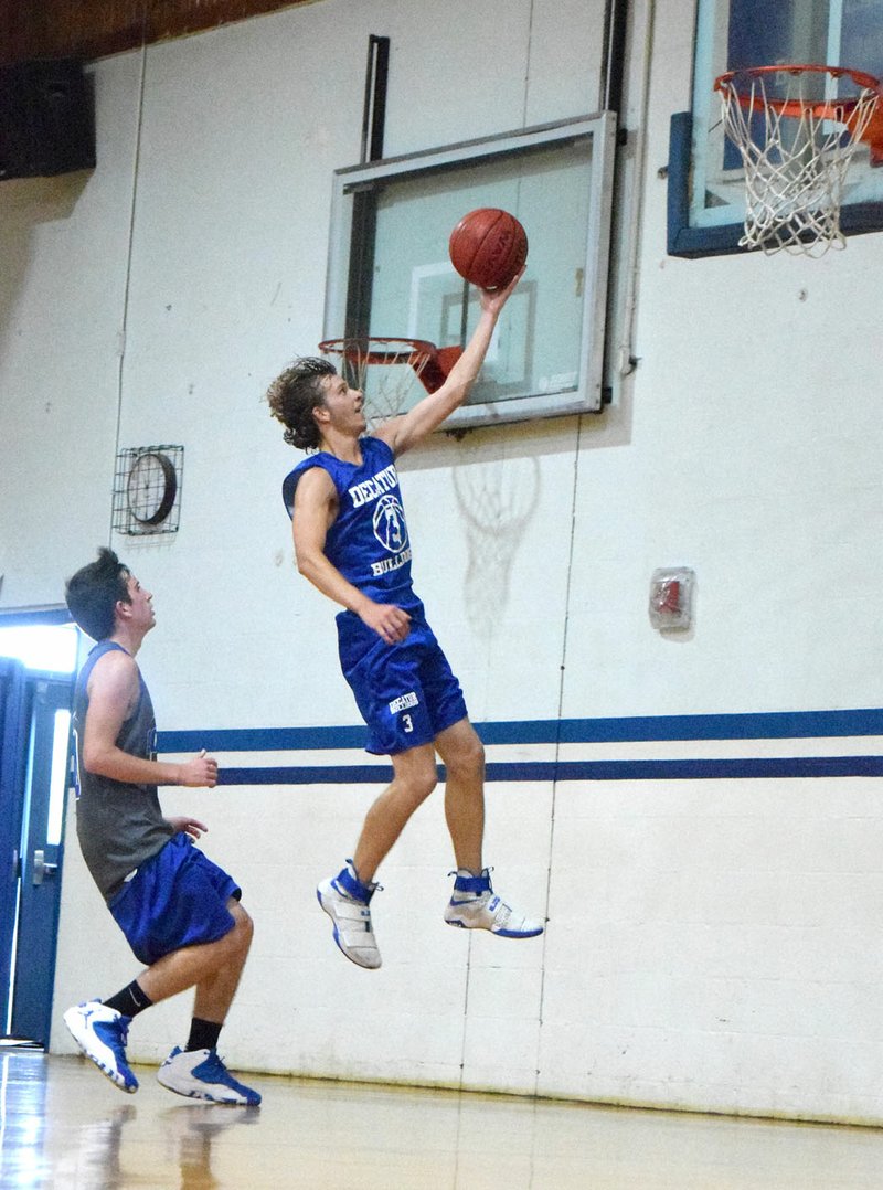 Photo by Mike Eckels Decatur's Taylor Haisman goes for a reverse layup during Colcord Summer Basketball at Colcord High School June 12. Haisman, along with fellow seniors Garry Wood, Levi Newman and Dylan Wells, will return for their final season this November.