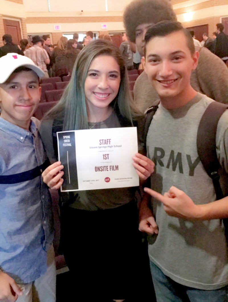 Photo submitted Luis Ornelas, Averie Headerick and Ian Miller held up their first place award for short film from the Spring Creek Festival, held at The Jones Center in Springdale on Oct. 18 and 19. Siloam Springs High School students brought home a total of 15 awards, including six first place awards, from the event.
