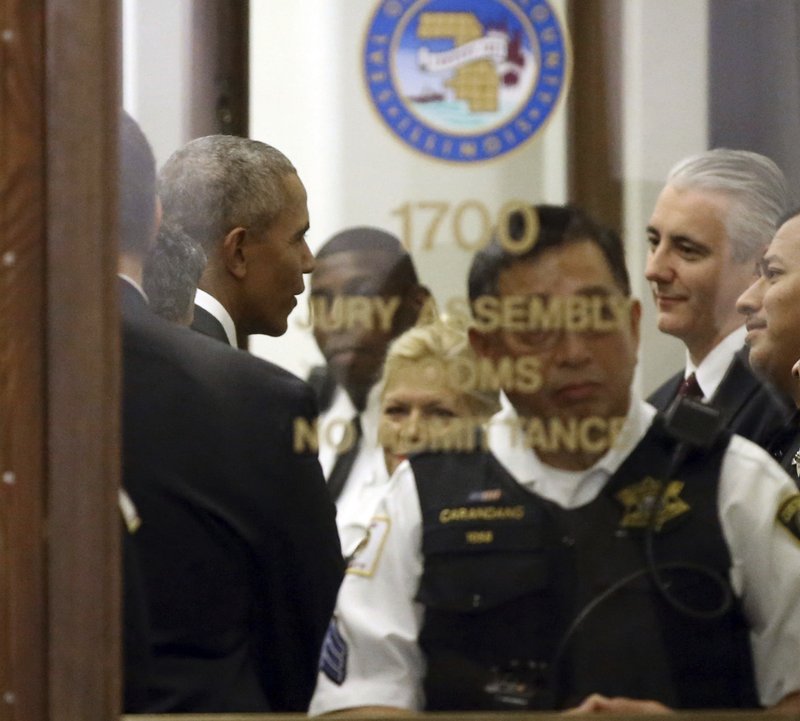 Former President Barack Obama arrives for jury duty in the Daley Center on Wednesday, Nov. 8, 2017, in Chicago. Obama is in line to be paid the same $17.20 a day that others receive for reporting for jury duty. 