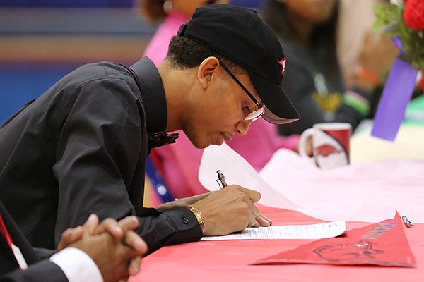 Parkview High School senior Ethan Henderson signs a national letter of intent to play basketball for the University of Arkansas on Wednesday, Nov. 5, 2017, at Parkview High School in Little Rock.
