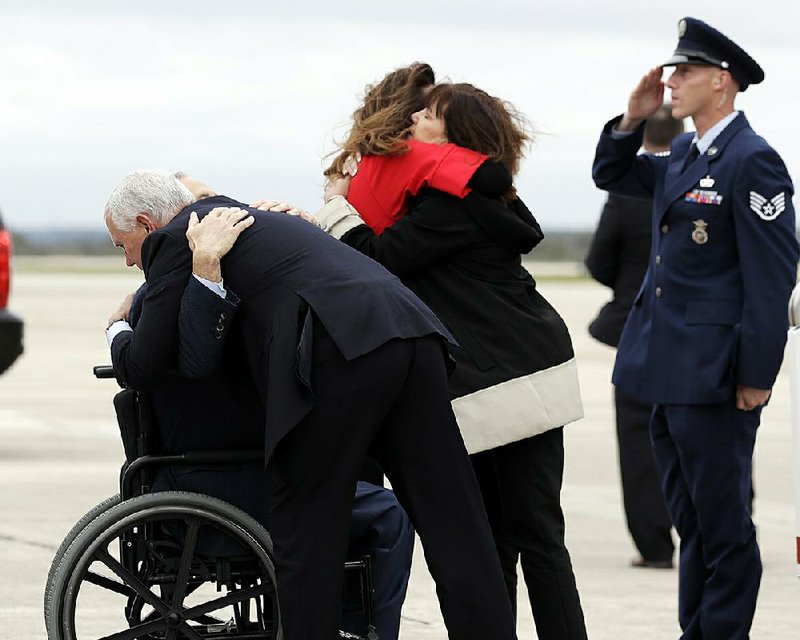 Vice President Mike Pence and his wife, Karen (right), on Wednesday greet Texas Gov. Greg Abbott (in wheelchair) and Abbott’s wife, Cecilia, in San Antonio. The Pences arrived to meet with victims of Sunday’s church shooting. 