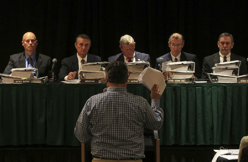 Farmer Matt Smith of Mississippi County speaks Wednesday before the state Plant Board in Little Rock during a public hearing on the use of dicamba. 