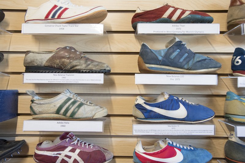 NWA Democrat-Gazette/J.T. WAMPLER Vintage shoes are on display at the Rush Running shoe museum in Bentonville. Owner Mike Rush asserts the collection is one of the most well-documented in the country.