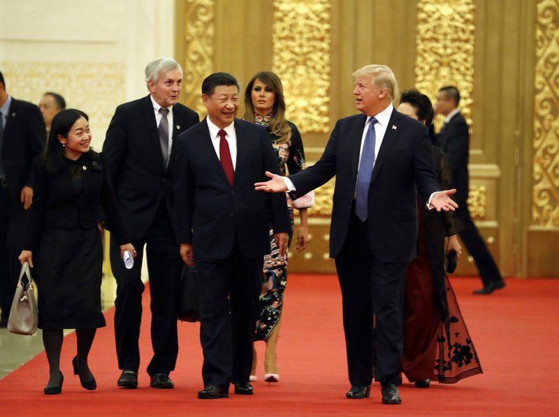 U.S. President Donald Trump and Chinese President Xi Jinping arrive for a state dinner at the Great Hall of the People on Thursday, Nov. 9, 2017, in Beijing. 