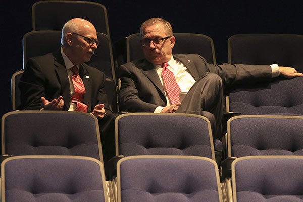 University of Arkansas chancellor Joseph Steinmetz, left, and athletics director Jeff Long sit inside an auditorium at Pulaski Tech during a meeting of the UA Board of Trustees on Thursday, Nov. 9, 2017, in North Little Rock. 