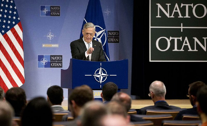 U.S. Secretary for Defense Jim Mattis speaks during a media conference after a meeting of NATO defense ministers at NATO headquarters in Brussels on Thursday, Nov. 9, 2017. (AP Photo/Virginia Mayo)