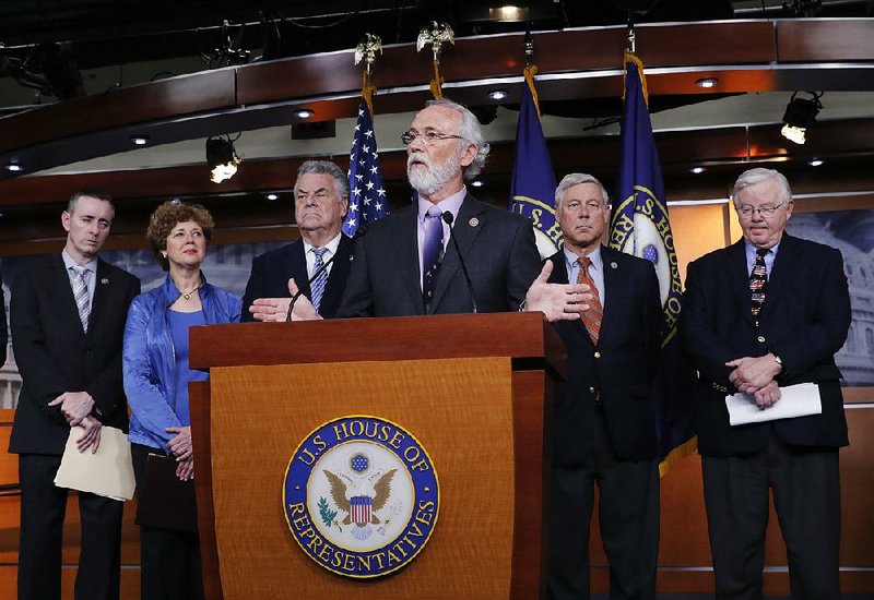 U.S. Rep. Dan Newhouse of Washington state is joined by fellow Republicans to discuss their support of the Deferred Action for Childhood Arrivals program during a news conference Thursday on Capitol Hill. 