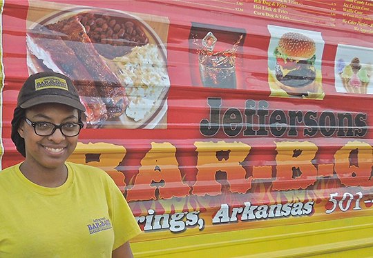 The Sentinel-Record/Submitted Photo SPECIAL GUEST: Leann Jefferson, co-owner of Jefferson's Bar-B-Que, appears next to her food truck in this undated photo. Jefferson will be the guest speaker at this month's NAACP meeting where they will be celebrating 75 years of service to the community.