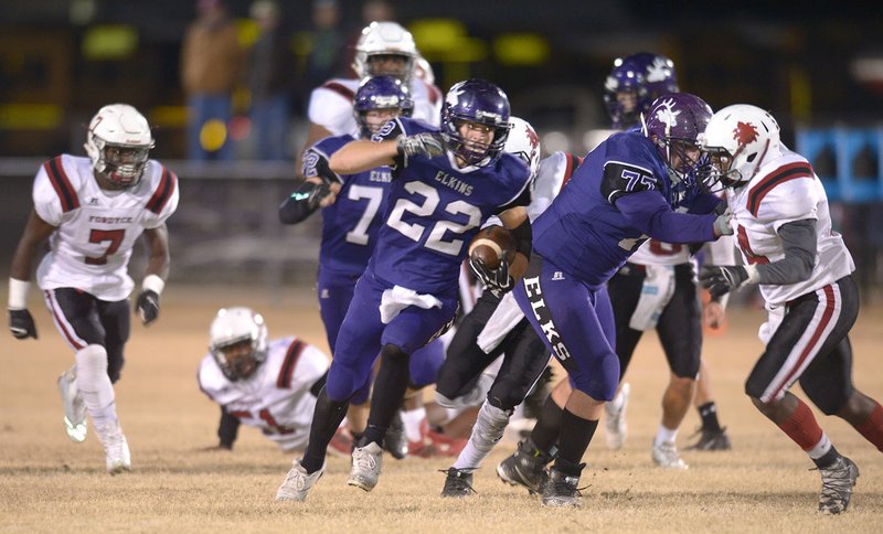 NWA Democrat-Gazette/ANDY SHUPE Elkins running back Chance Jones (22) cuts upfield through the Fordyce defense Friday on his way to the end zone at John Bunch Jr. Memorial Field in Elkins. Visit nwadg.com/photos for more photos from the game.