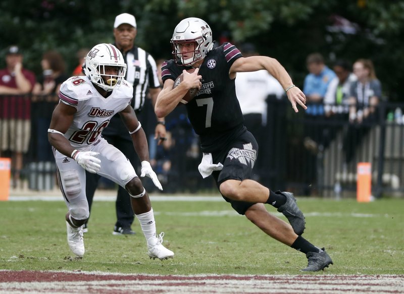 The Associated Press BREAKING FREE: Mississippi State quarterback Nick Fitzgerald (7) runs for a first down past Massachusetts linebacker Jarell Addo (26) in the second half of last Saturday's game against in Starkville, Miss. Mississippi State won 34-23, moving to No. 18 before today's game against Alabama.