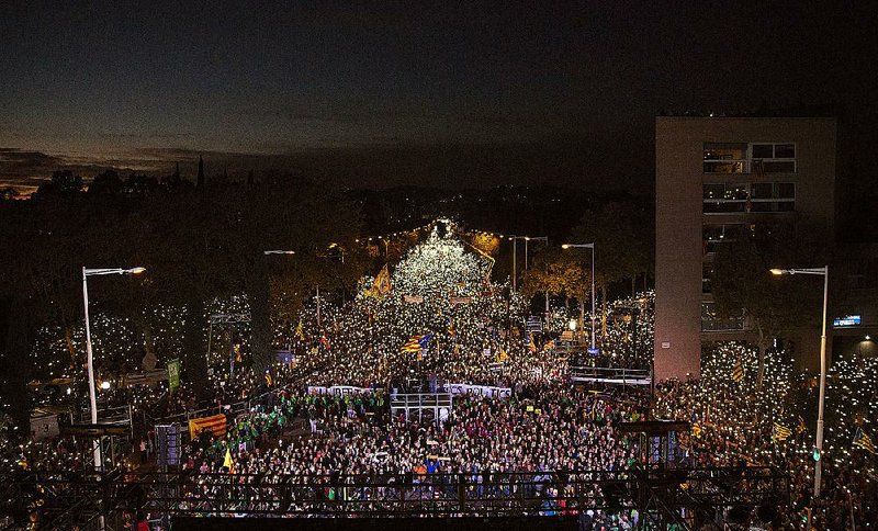 Demonstrators in Barcelona, Spain, call Saturday for the release of jailed Catalan politicians. 