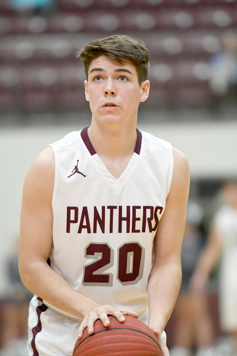 Bud Sullins/Special to Siloam Sunday Siloam Springs junior Murphy Perkins lines up a free throw during a game last season. Perkins and the Panthers boys basketball team open the season Tuesday at Rogers Heritage.