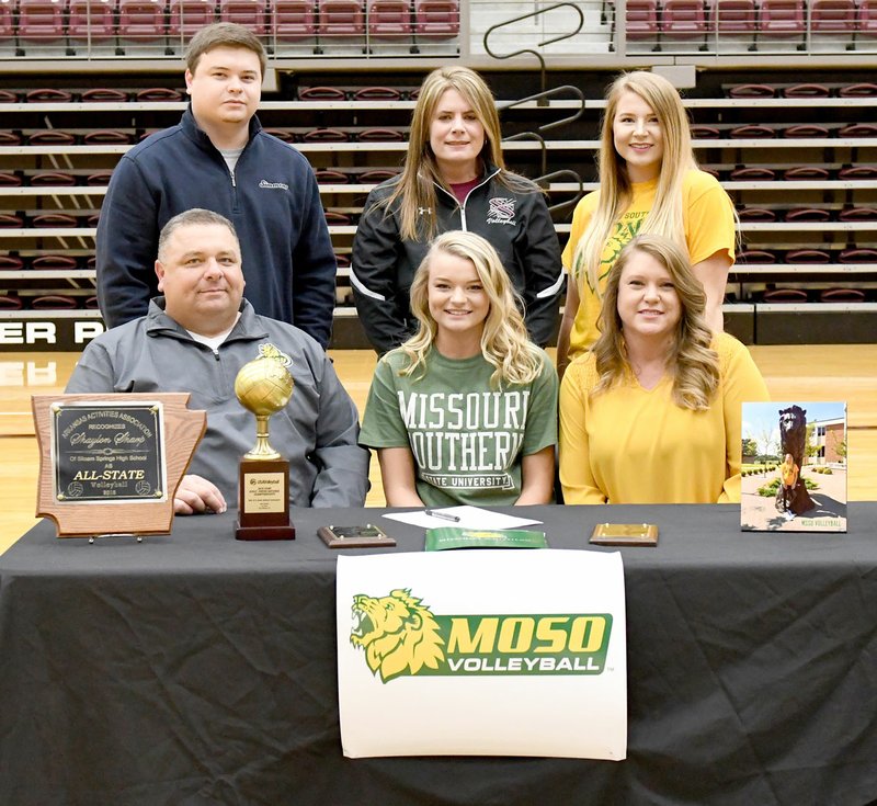 Bud Sullins/Special to Siloam Sunday Siloam Springs senior Shaylon Sharp, middle, signed a letter of intent Wednesday to play volleyball at Missouri Southern State. Pictured are: Front from left, father Daron Sharp, Shaylon Sharp, mother Sherri Sharp; back, brother Boston Sharp, Siloam Springs volleyball coach Joellen Wright, and sister Makenzie Sharp.