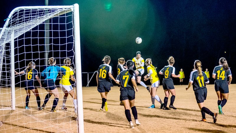 Photo courtesy of JBU Sports Information John Brown forward Jastin Redman attempts to head a ball during Friday's Sooner Athletic Conference Tournament championship match at Alumni Field. Science and Arts (Okla.) defeated John Brown 2-1 in overtime.