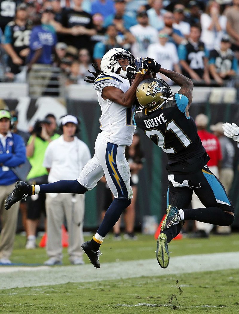Jacksonville Jaguars cornerback A.J. Bouye (21) intercepts a pass intended for Los Angeles Chargers wide receiver Travis Benjamin during the Jaguars’ 20-17 overtime victory Sunday.