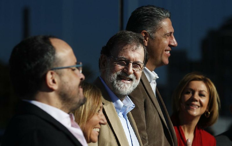 Spain’s Prime Minister Mariano Rajoy (center) attends a Catalan regional People’s Party meeting in Barcelona, Spain, on Sunday.
